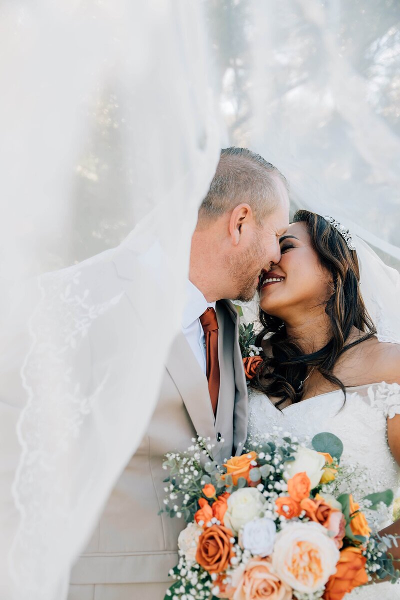 wedding day couple kissing Aspen Suzanne Photography