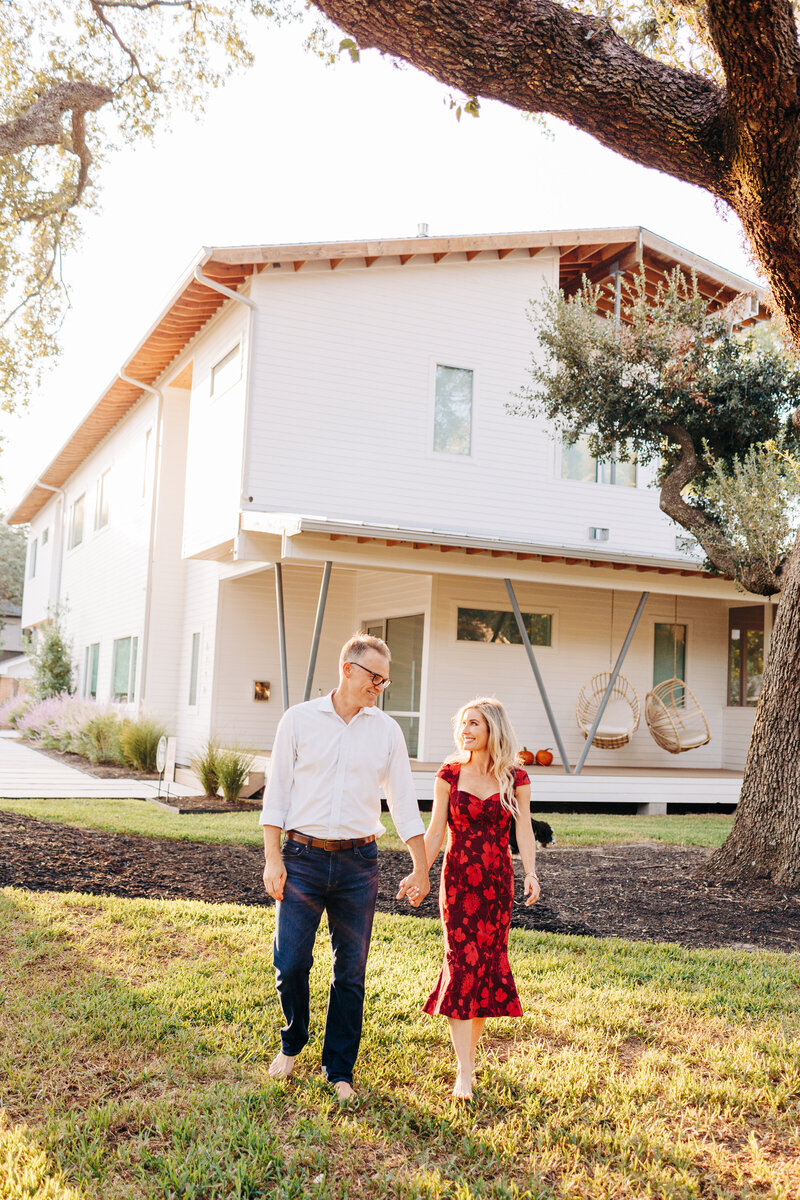 couple walking outside of their Houston home