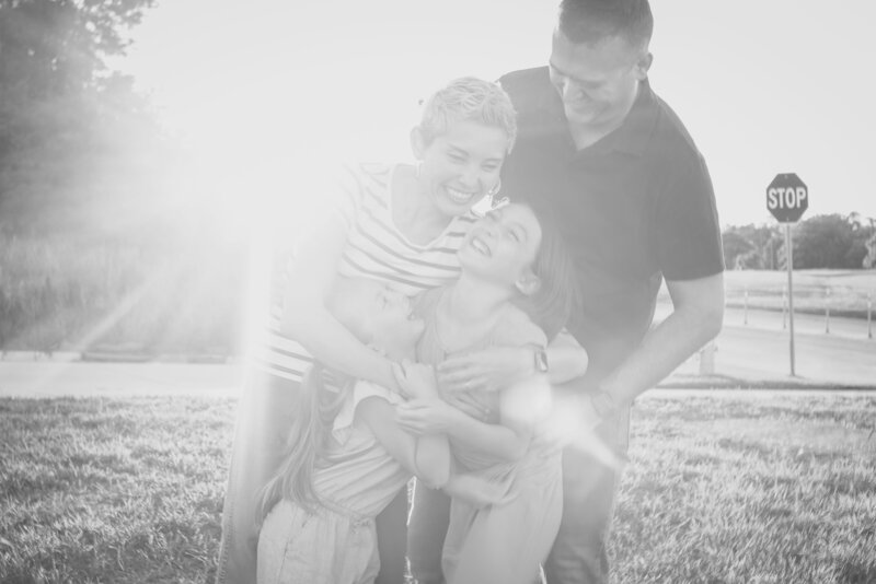 black and white image family embracing