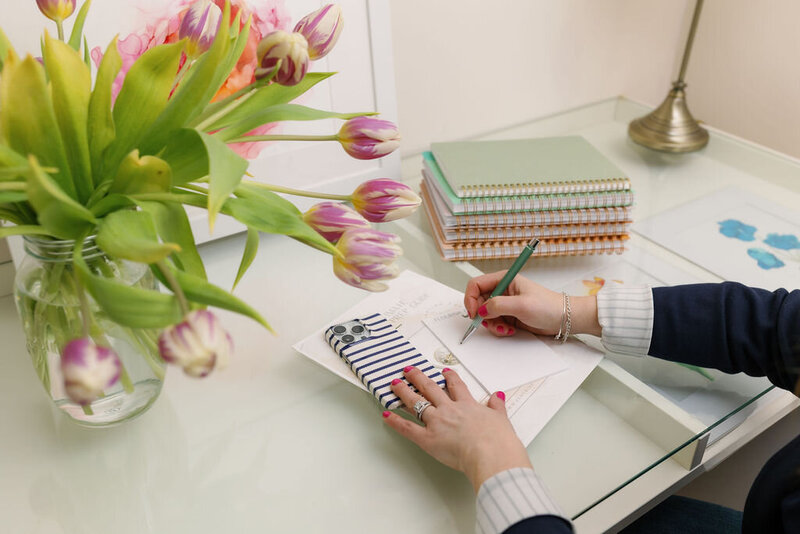 Desktop with career planning notebook and flowers