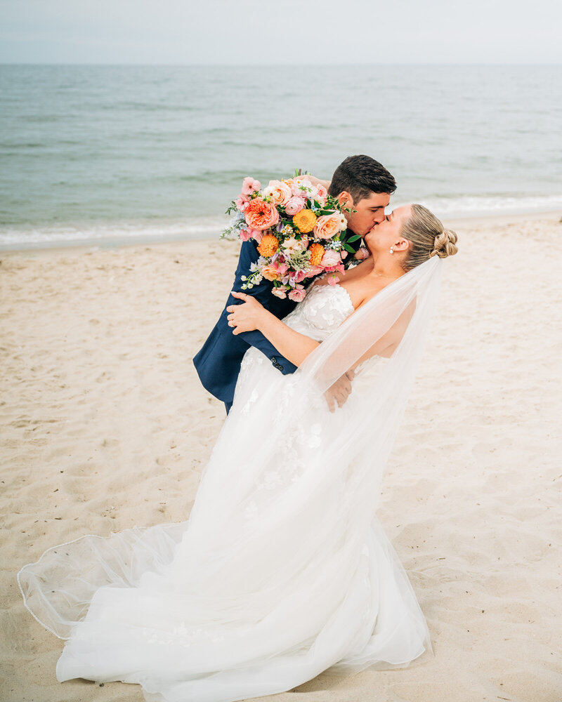 maryland wedding photographer couple kissing on the beach
