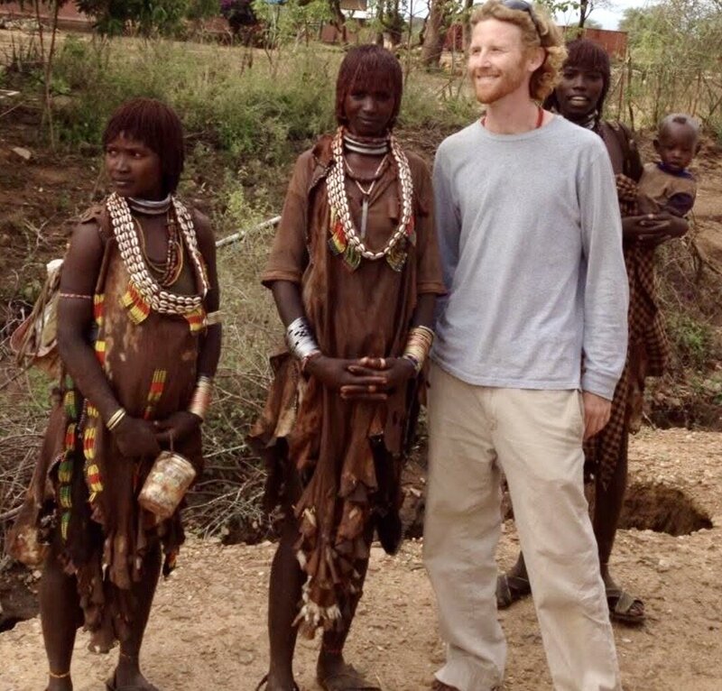 Daniel connecting with people outdoors during his travels