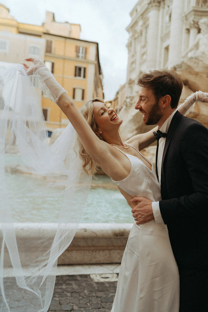 rome elopement at the trevi fountain captured by elsie goodman, an italy wedding photographer