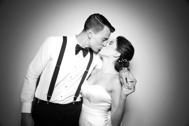 Kissing wedding couple in black and white