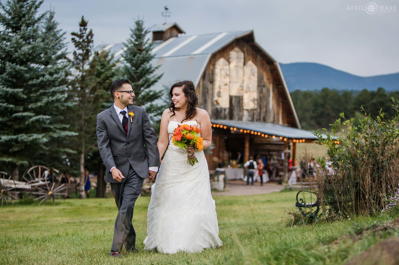 Cute wedding photo with barn backdrop in Evergreen CO