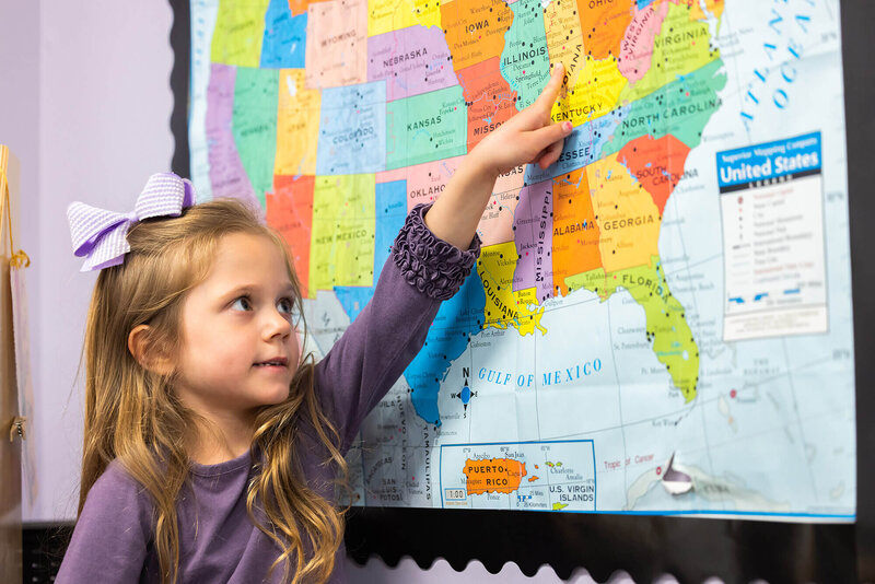 girl pointing to map