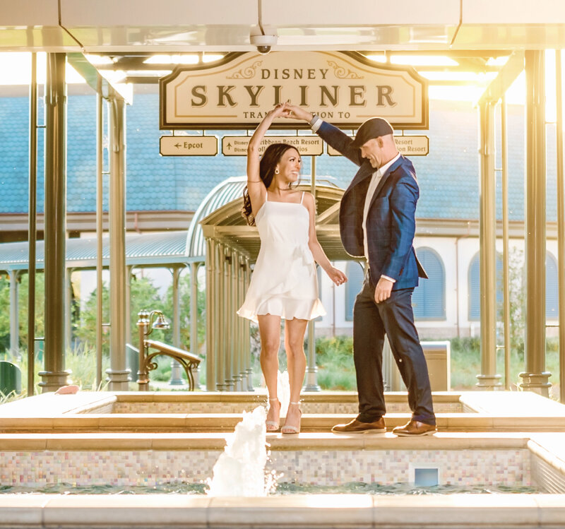 Couple dancing at Disney Riviera resort by skyliner entrance