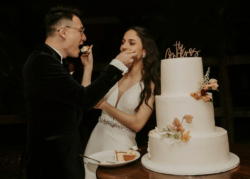 Bianca and Sebastian shove cake in each others face.