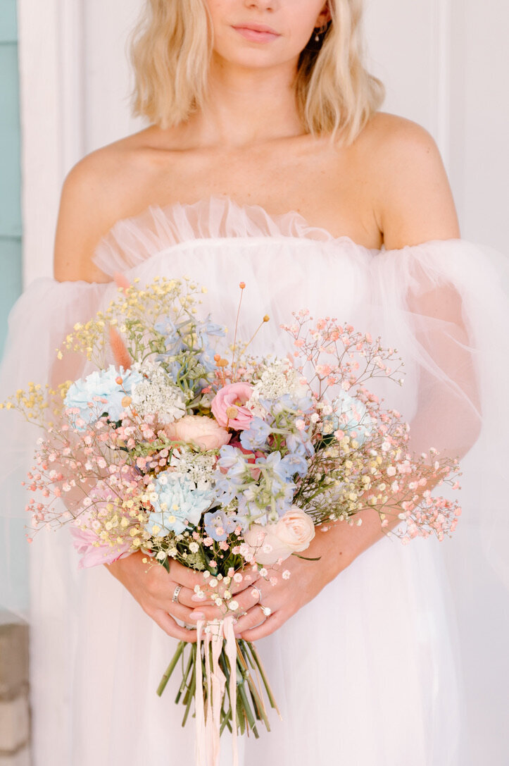 bride holding a flower bouquet