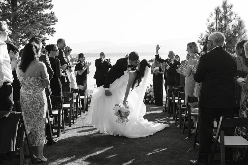 edgewood lake tahoe resort wedding ceremony photo--dip kiss at the end of aisle