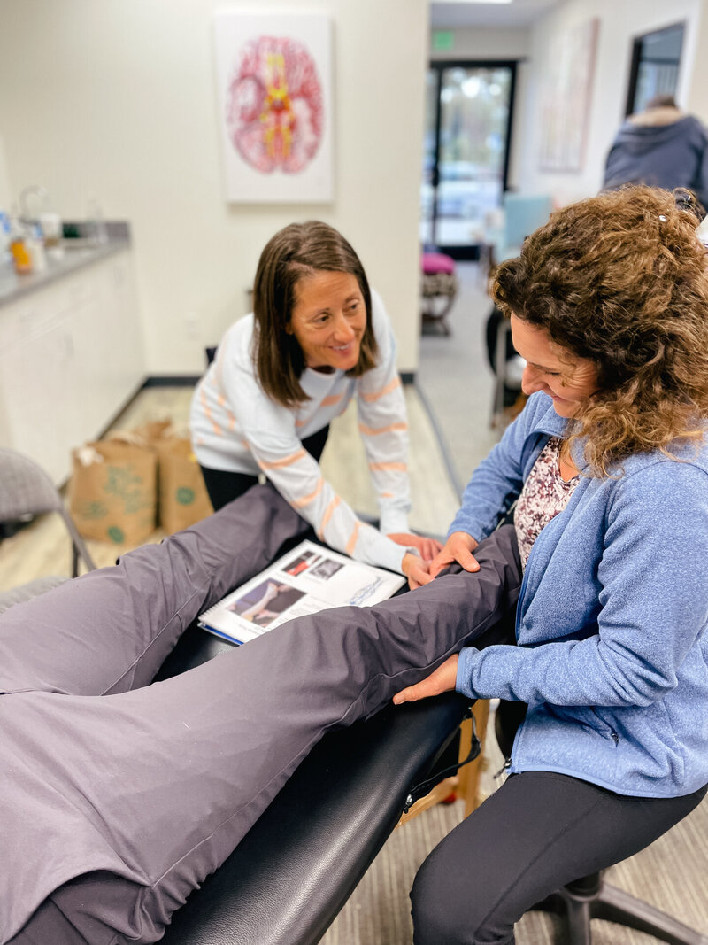 Physical Therapist working on patient's calf