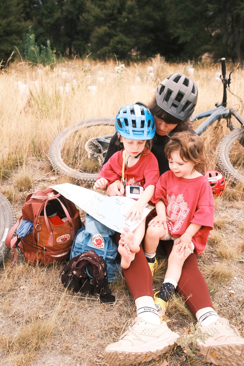 A family enjoying the Love Wanaka Map. 
