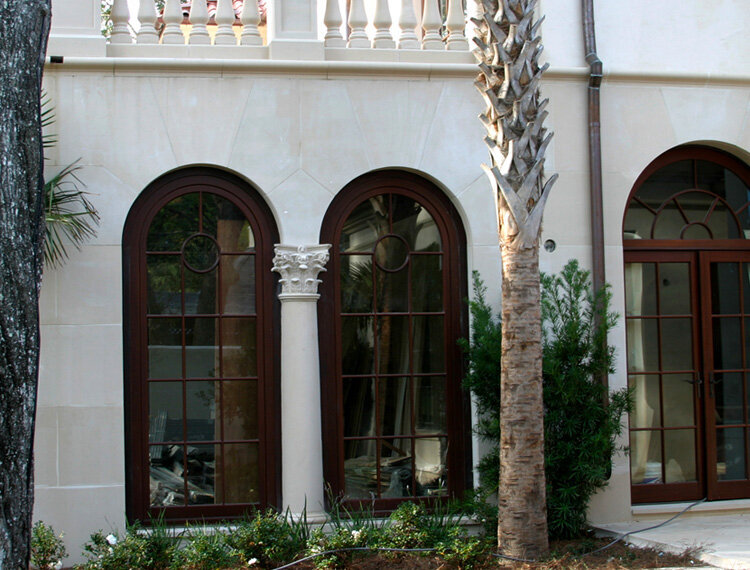 Decorative cast stone columns on a Mediterranean home