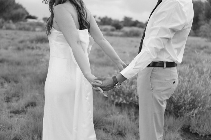 couple walking hand in hand at Alameda Open Space