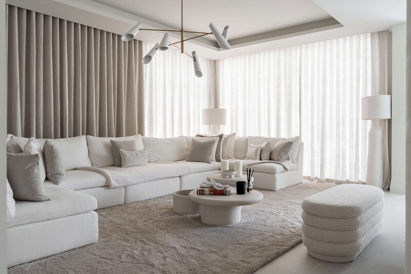 white and neutral living room with large white sectional