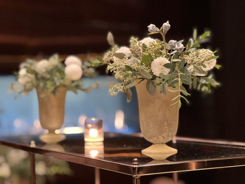 Photo of a boquet of flowers on a desk.