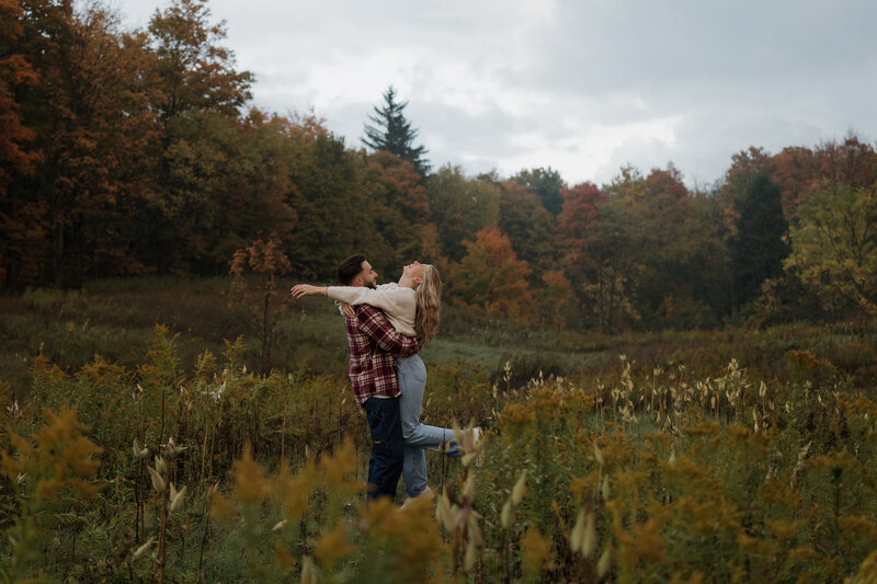 Couple running away for sunset during their wedding reception in Ontario