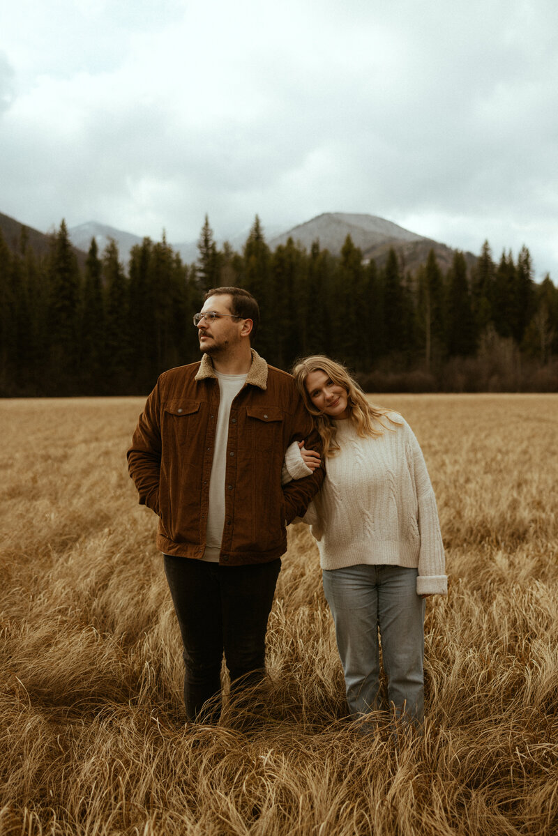 national park couple posing in Glacier NP