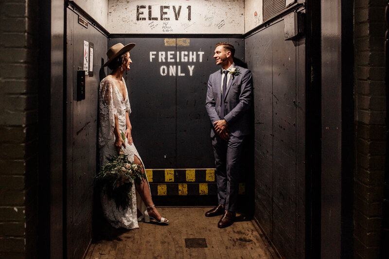 bride and groom in an elevator