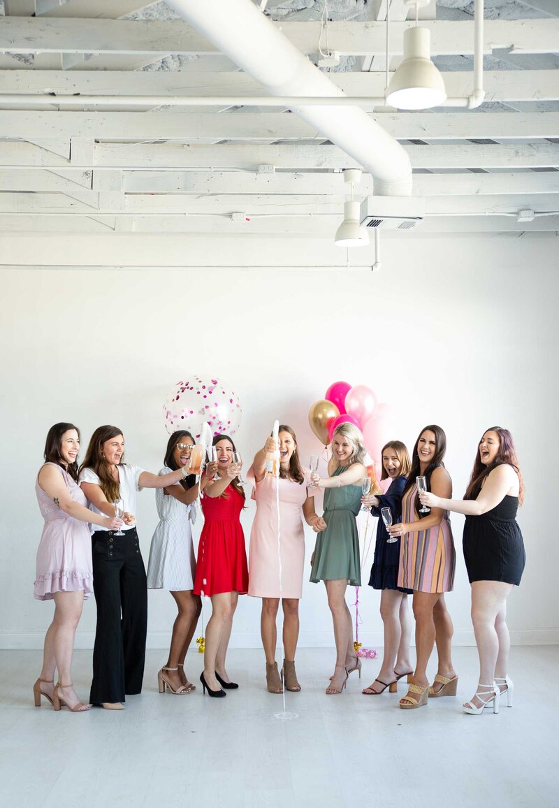 CM Promotions Team Popping Champagne | Dallas and Fort Worth Wedding and Event Planners