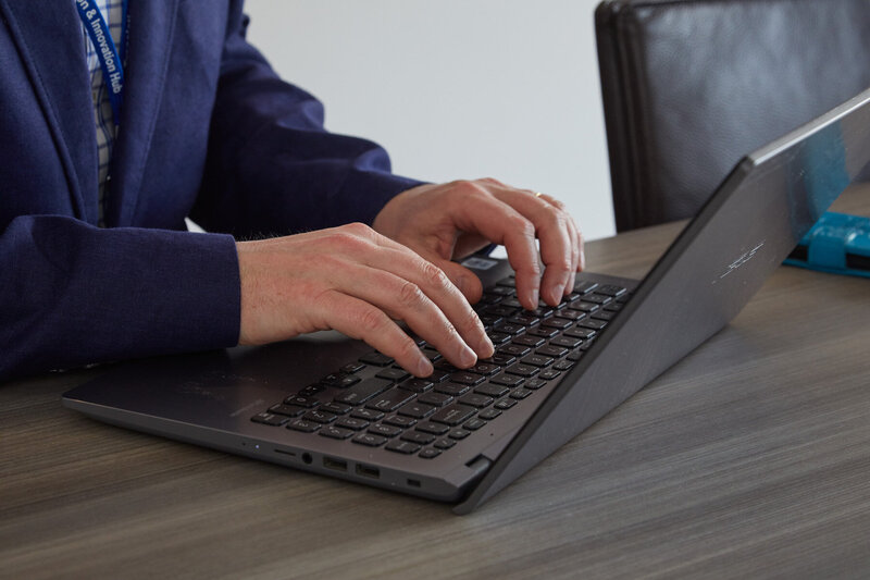image of Dr Matt Williams typing on his laptop