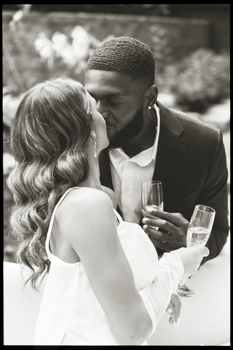 Couple kissing at Mustard Seed Garden in Noblesville Indiana 