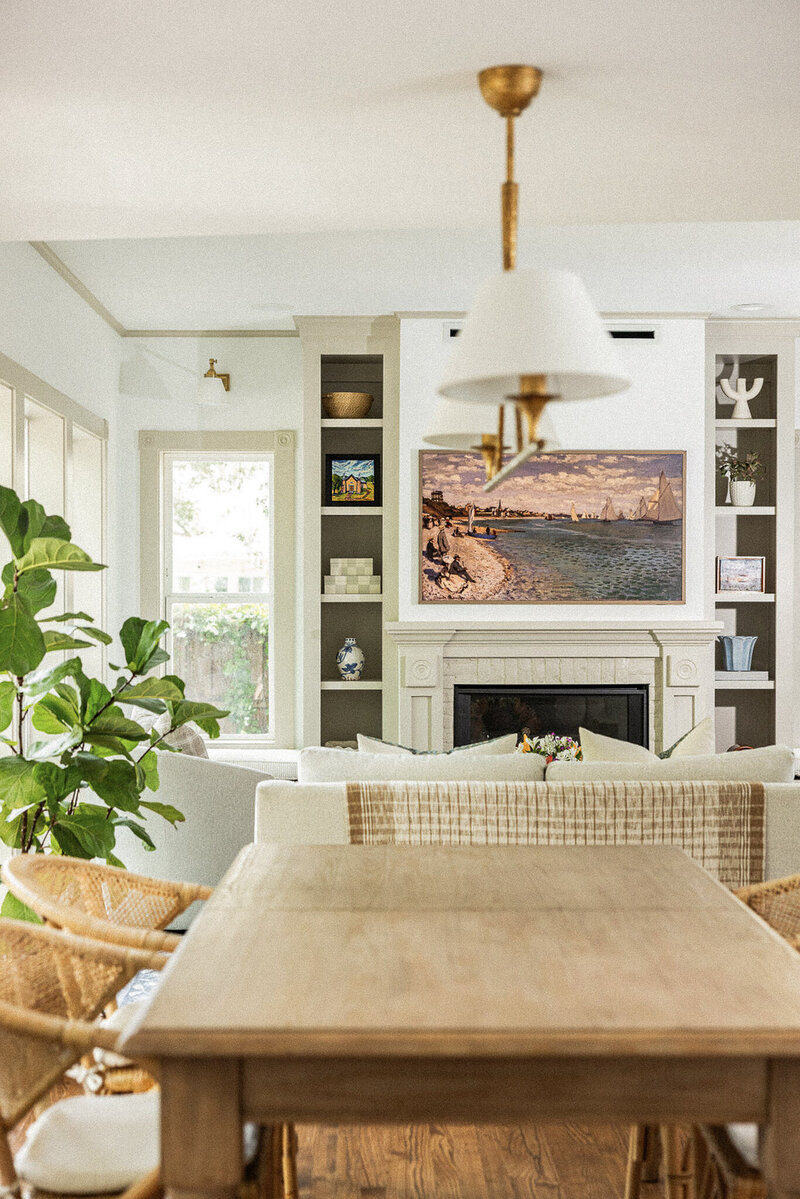 Bright dining room with built in cabinets around fireplace, designed by Hope Miriam Designs in DFW