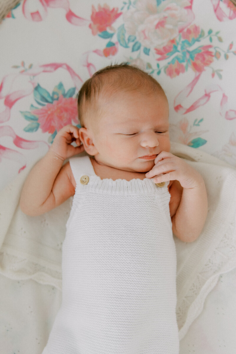 newborn on bassinet