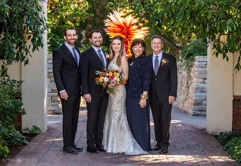 Family photos in front of the Chihuly Sclupture in the Romantic Gardens at Denver Botanic Gardens