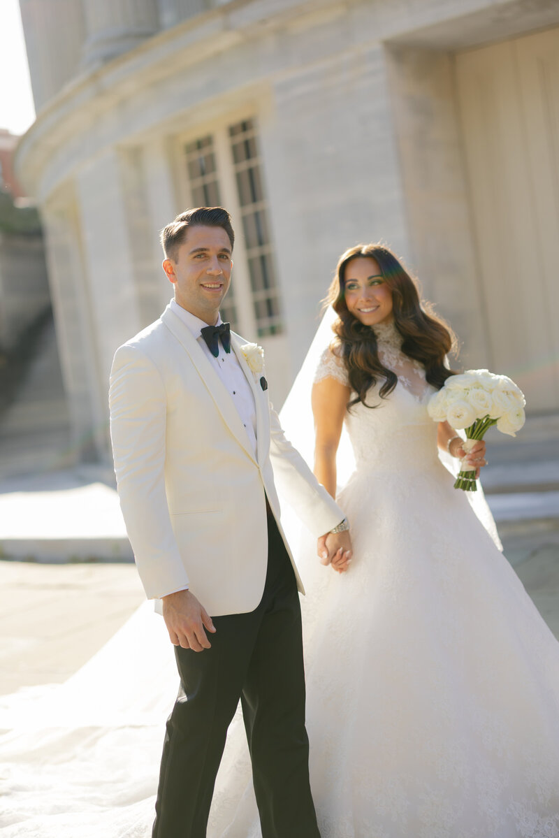 Romantic candlelit wedding tablescape with pastel luxury florals at an elegant Philadelphia reception