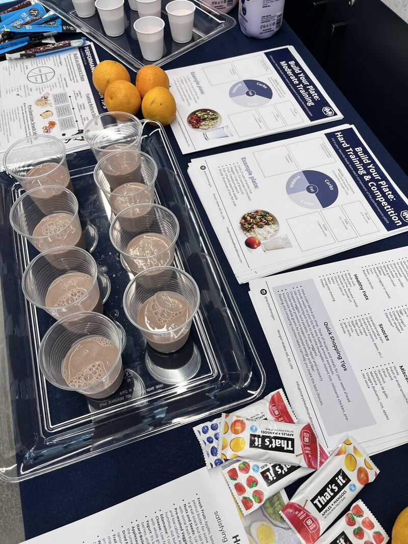 Sports nutrition consultant featured in media coverage while leading a nutrition workshop on general fitness, health, wellness, and strategies to improve energy, recovery, and overall well-being.