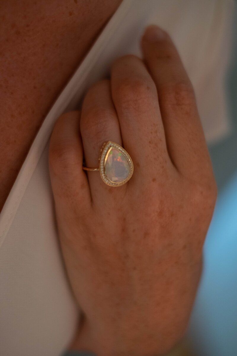 Opal Starfall ring with natural diamond halo and 14k gold setting