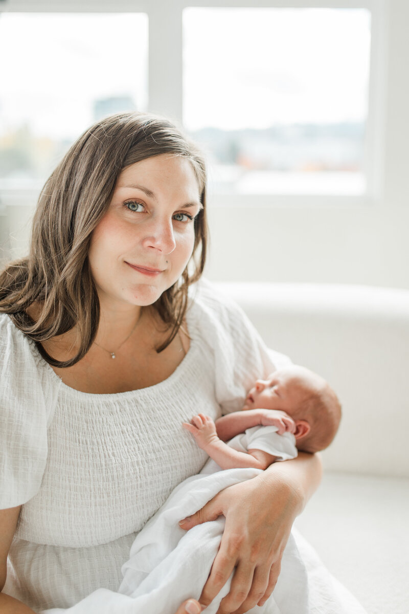 Mother happily holding her newborn