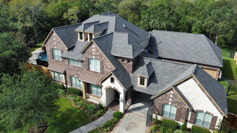 Dallas, TX home with birdseye view of roof replacement and repair done
