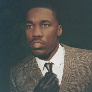 Giveons 2025 R&B/Soul album Beloved on Apple Music, showing the album cover with the artist in a suit