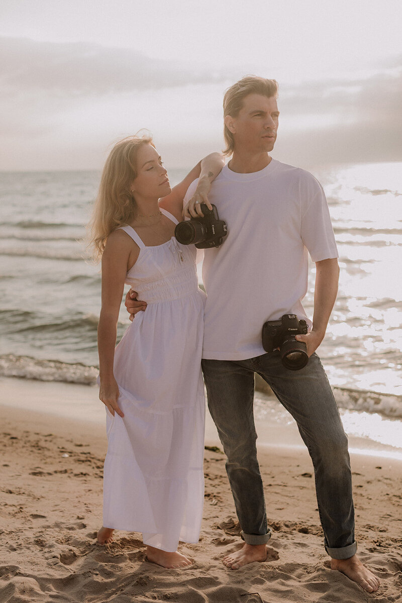 couple on beach engagement session at sunset