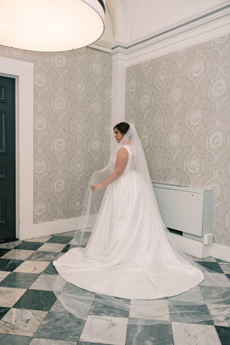 A bride poses for her bridals inside Hotel Monaco in DC