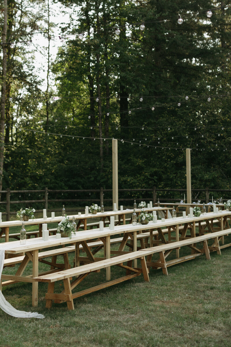 Outdoor Wedding Table scape white candles and flowers