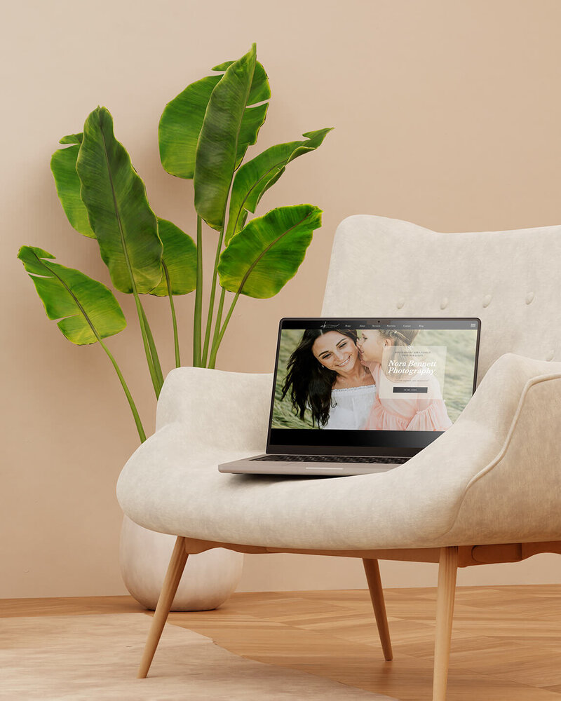 Picture of tablet sitting on a table with a portrait photography website on it. 