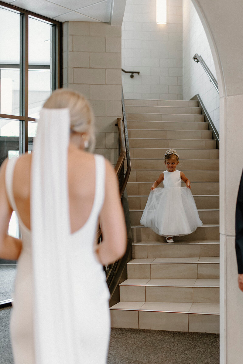 flower girl walking down church steps