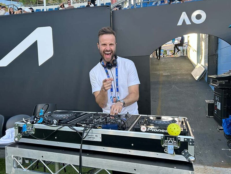 DJ entertaining fans courtside at the Australian Open with high-energy music performance