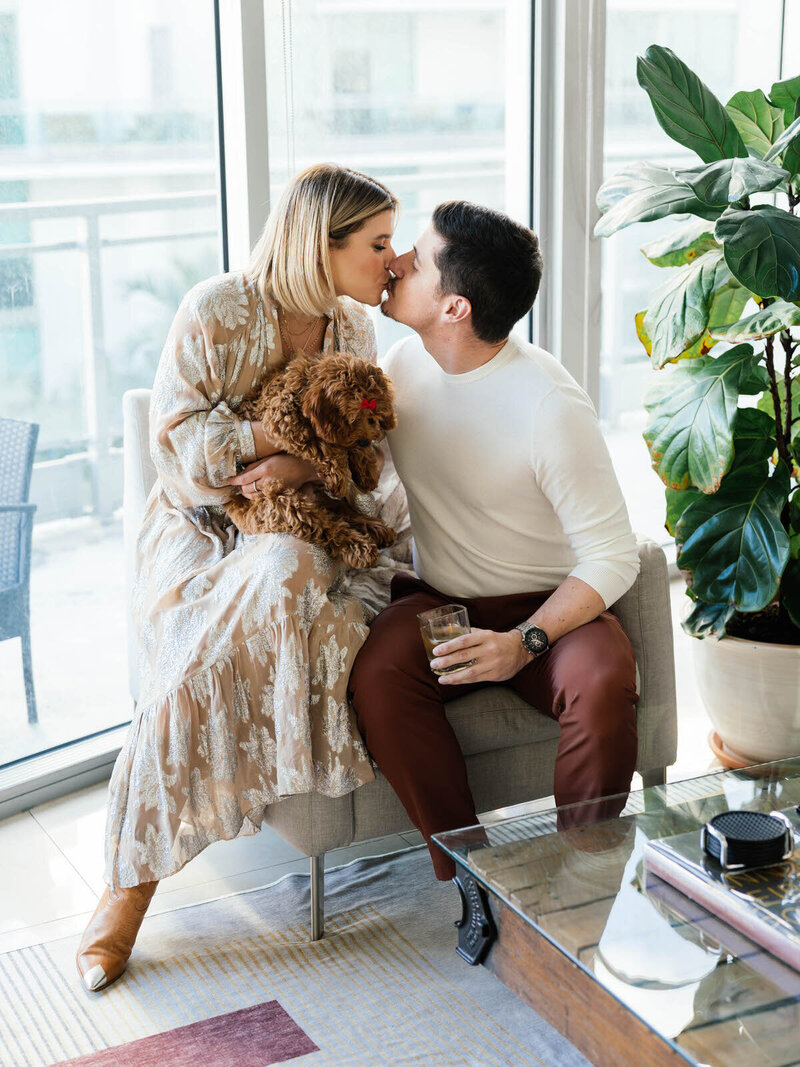 maternity pictures at home of a mom sitting on sofa