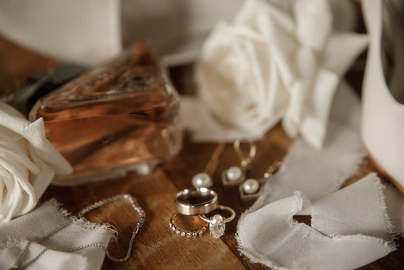 detail shots of brides perfume and jewelry at san diego wedding venue