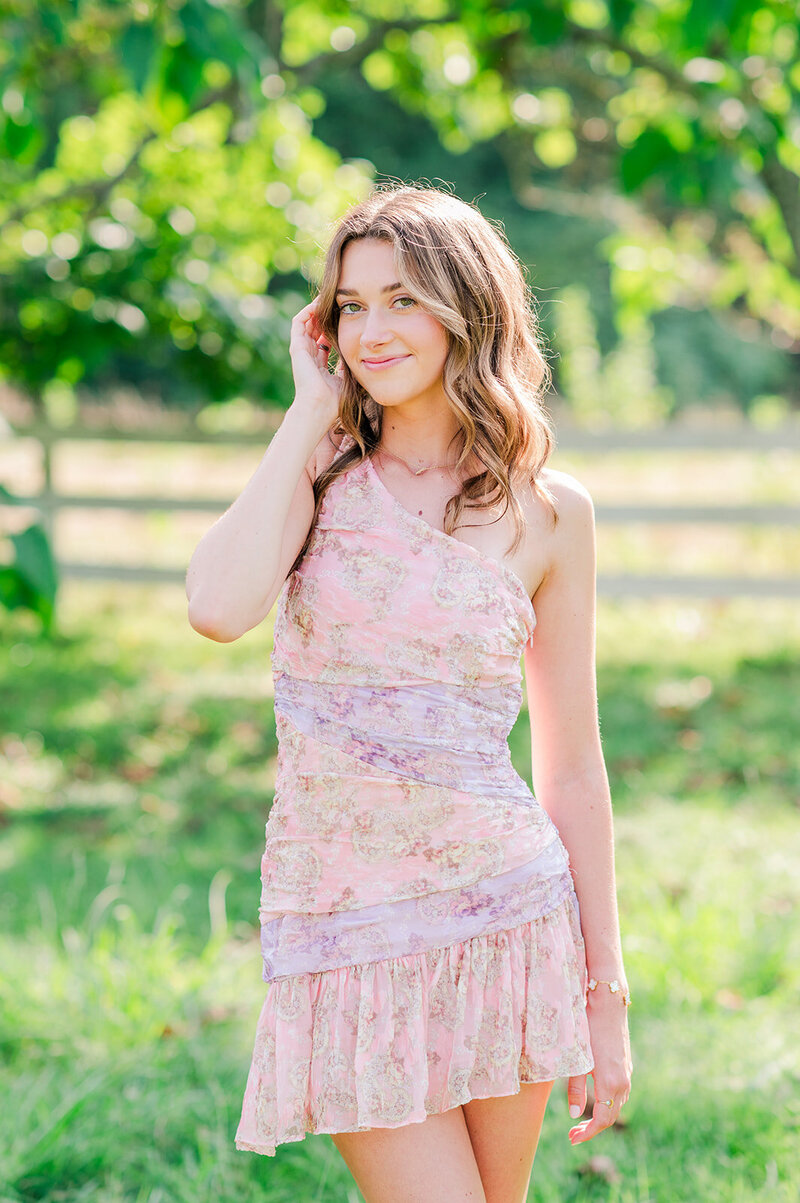 outdoor portrait of a girl in a pink dress