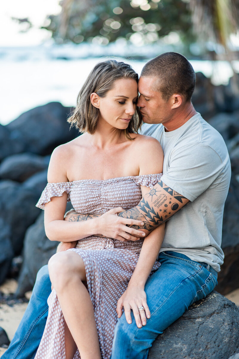 Kauai Couples Photographer with black lava rocks