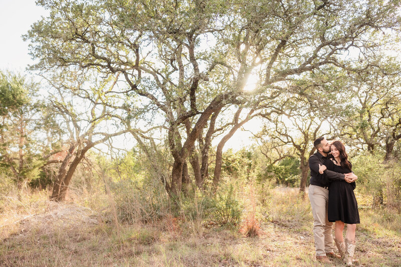 Couple go for a walk along the Colorado River during their engagement session at the 360 bridge in Austin, Texas. Photo taken by Austin Engagement Photographers, Joanna & Brett Photography