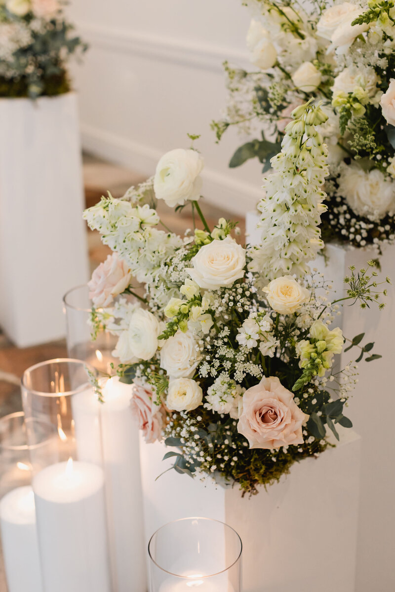 Pastel florals and white pillar candles for wedding decor, concept by Melissa Alison Events.