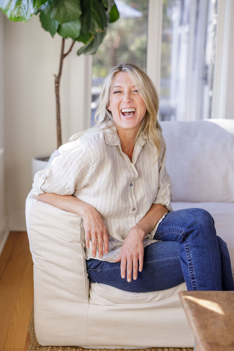 Kat smiling warmly, representing her friendly and empowering approach to health coaching.