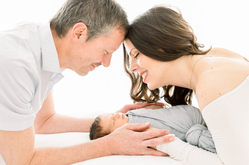 Two parents look over their baby born son at Hoag Hostpital