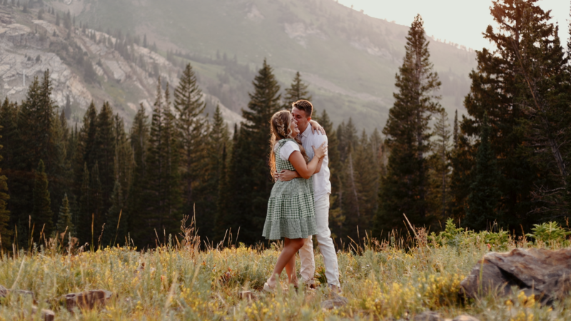Young Couple Hugging Outdoors in the Woods